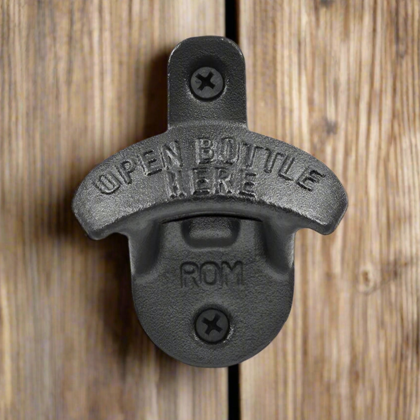 Black bottle opener with 'Open Bottle Here' text on a white background
