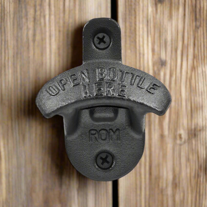 Black bottle opener with 'Open Bottle Here' text on a white background