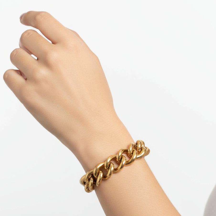 Gold chain bracelet on a white background