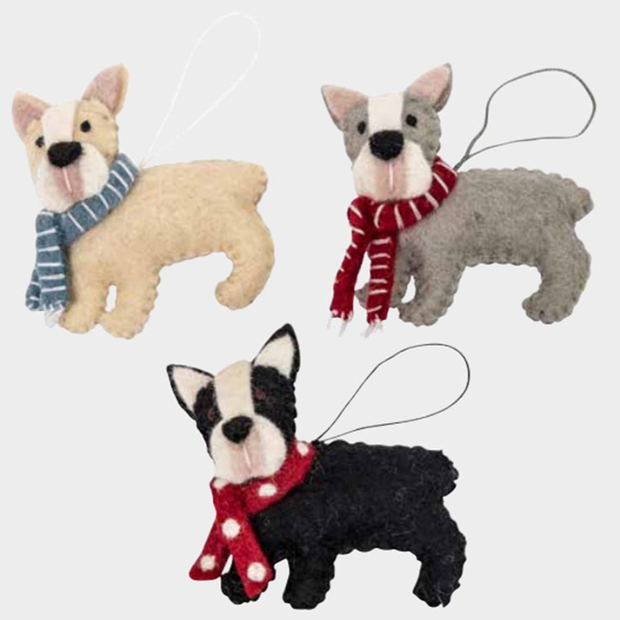 Three felt dog ornaments with scarves on a white background
