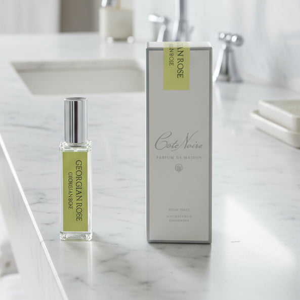 Perfume bottle and packaging of Cote Noire by Georgian Rose on a light gray background