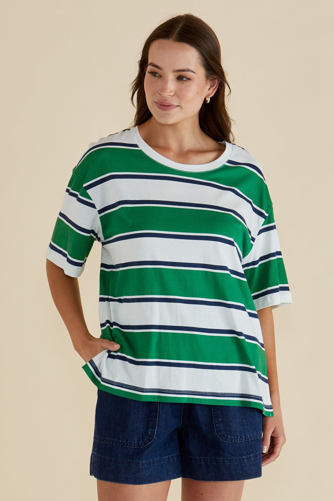 Lady wearing a navy, green & white striped boxy tee from the betty basics range in sizes 8-22.