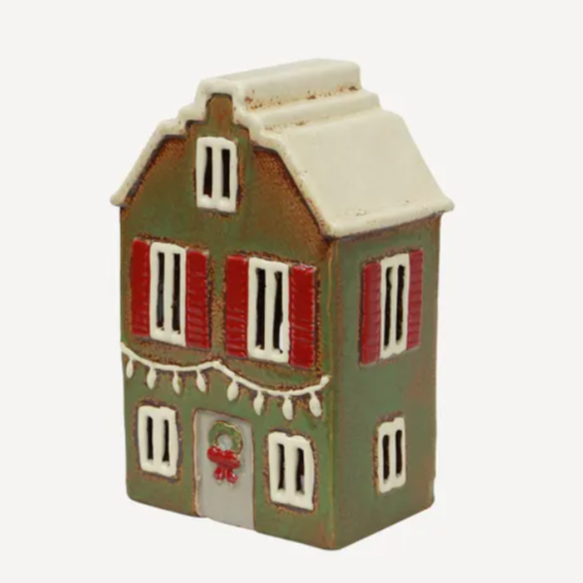 Decorative miniature house with a white roof on a white background