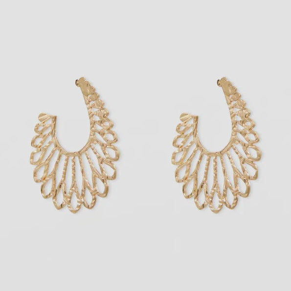 Pair of gold earrings on a light gray background