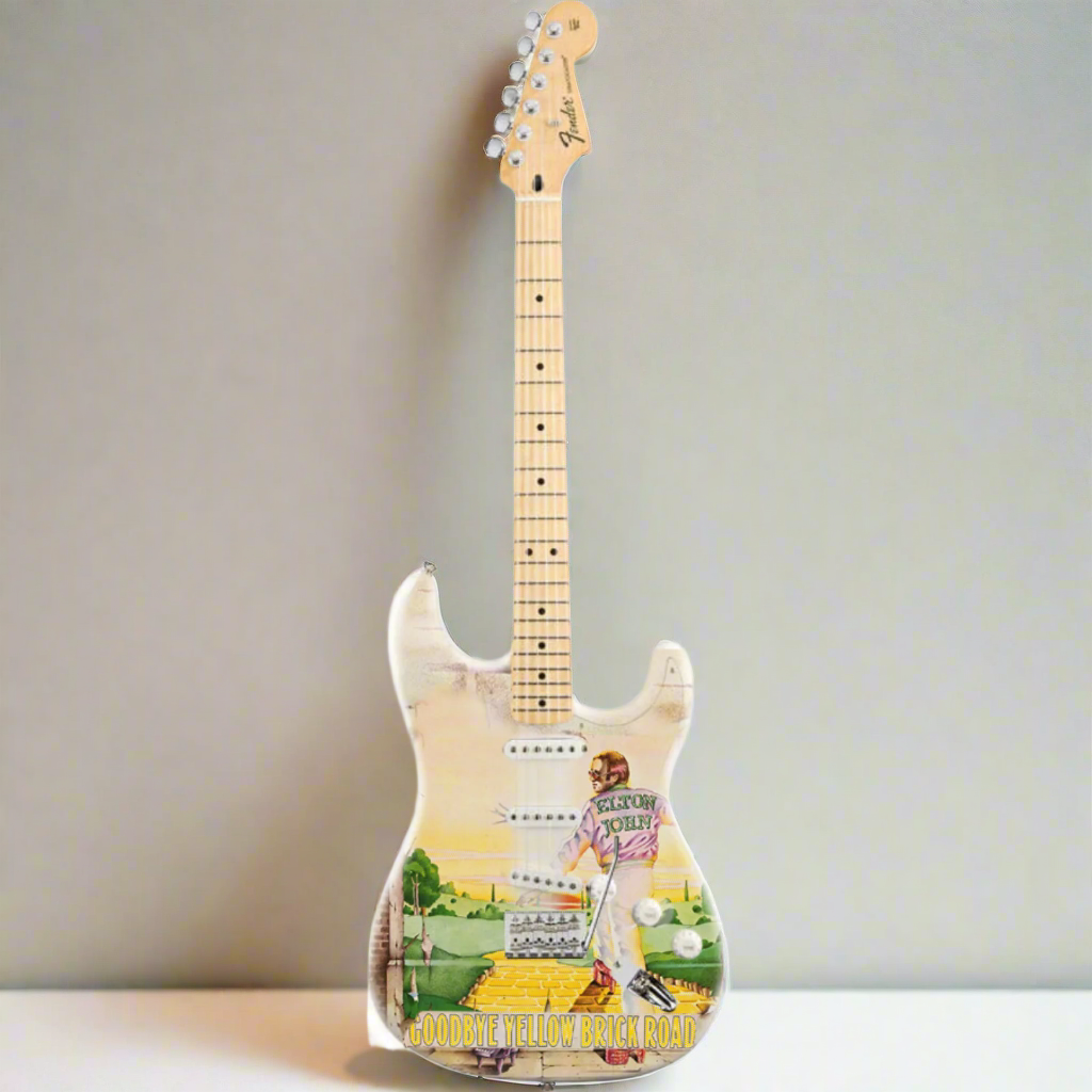 Guitar with a colorful design on a white background