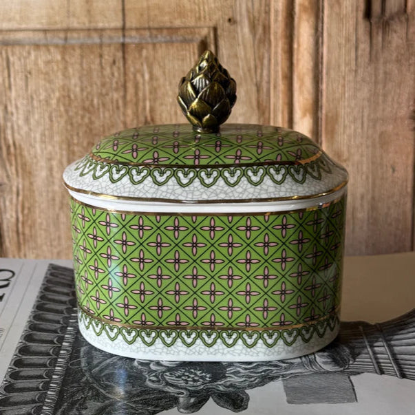 Decorative green box with a pattern on a magazine with 'The World of Interiors' title.