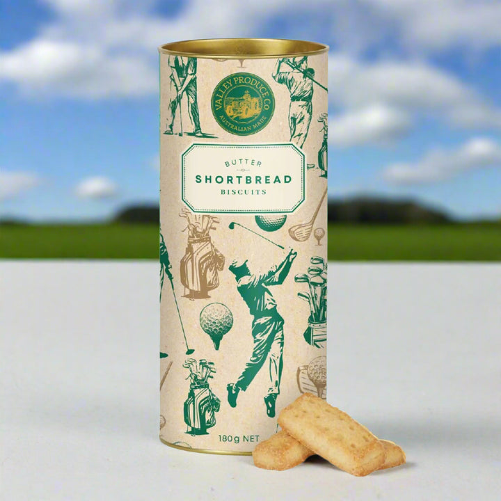 Cylindrical tin of butter shortbread biscuits with golf-themed design on a white background