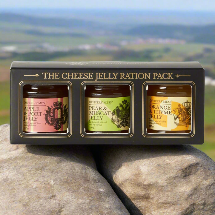 Three jars of jelly in a black box labeled 'The Cheese Jelly Ration Pack' on a white background.