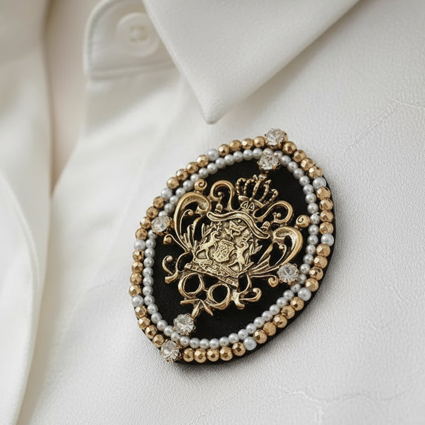 Decorative circular piece with gold and pearl design on a light gray background