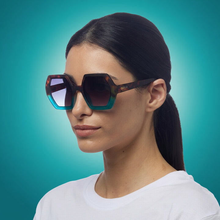 woman wearing stylish okkia sunglasses in blue & ocelot.