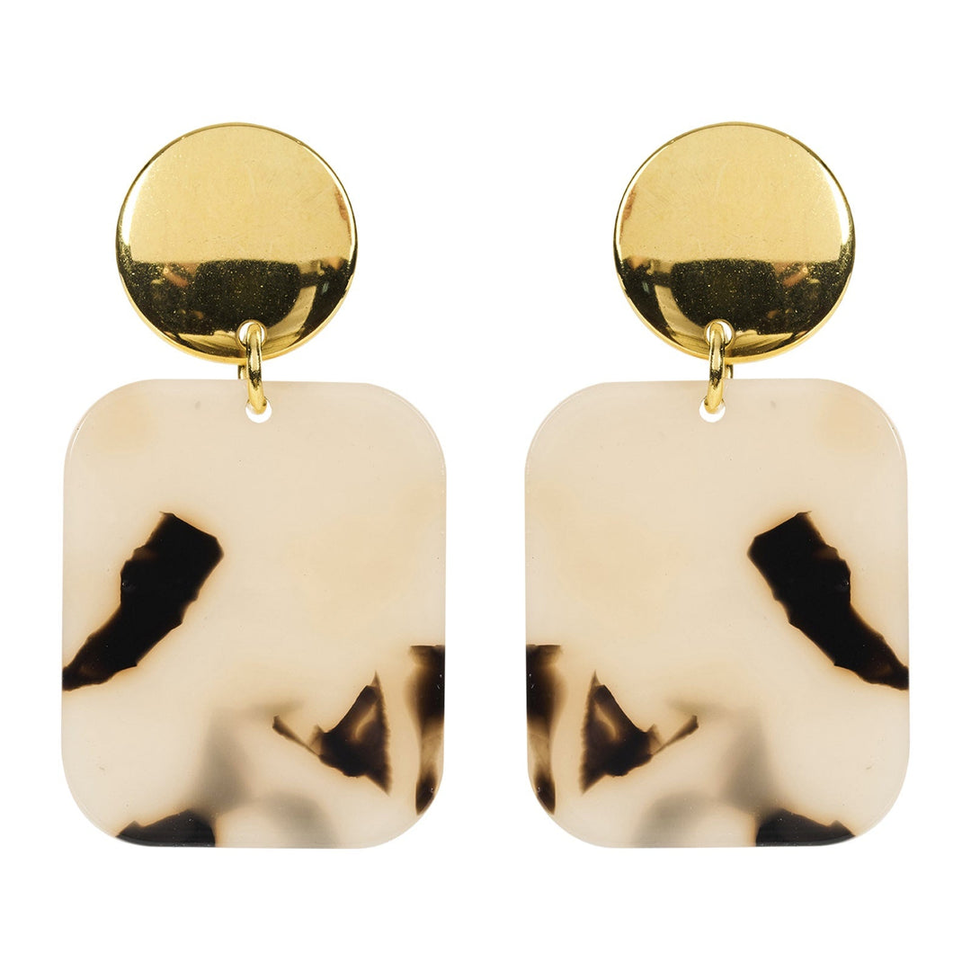 Pair of earrings with gold tops and beige bodies with black abstract designs on a white background