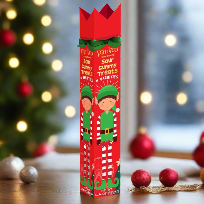 Red gummy CHRISTMAS treats box with elves on a white background
