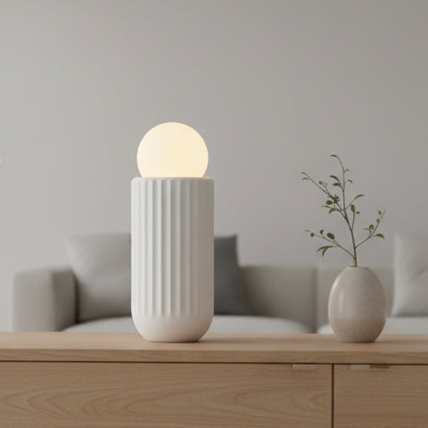 White cylindrical container with a glowing yellow sphere on a white background