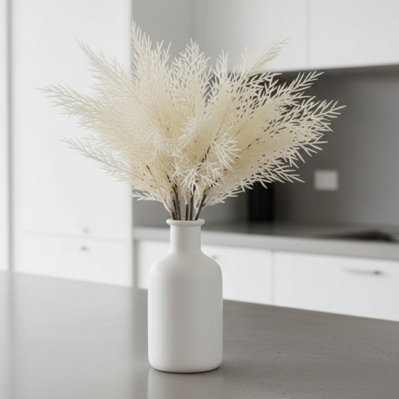 Artificial white tree branch on a light gray background