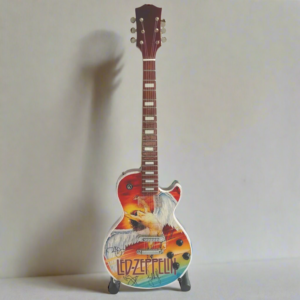 Colorful electric guitar with Led Zeppelin branding on a white background