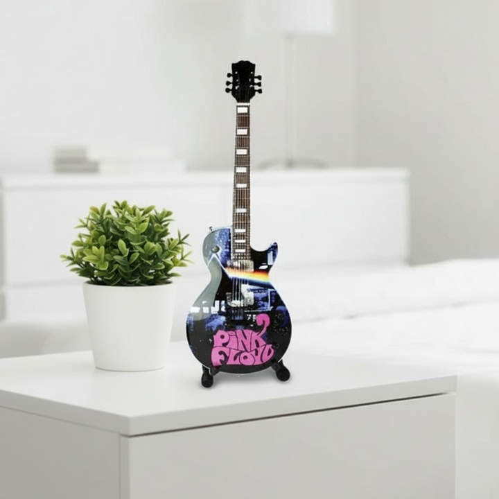 Pink Floyd electric guitar with colorful design on a white background