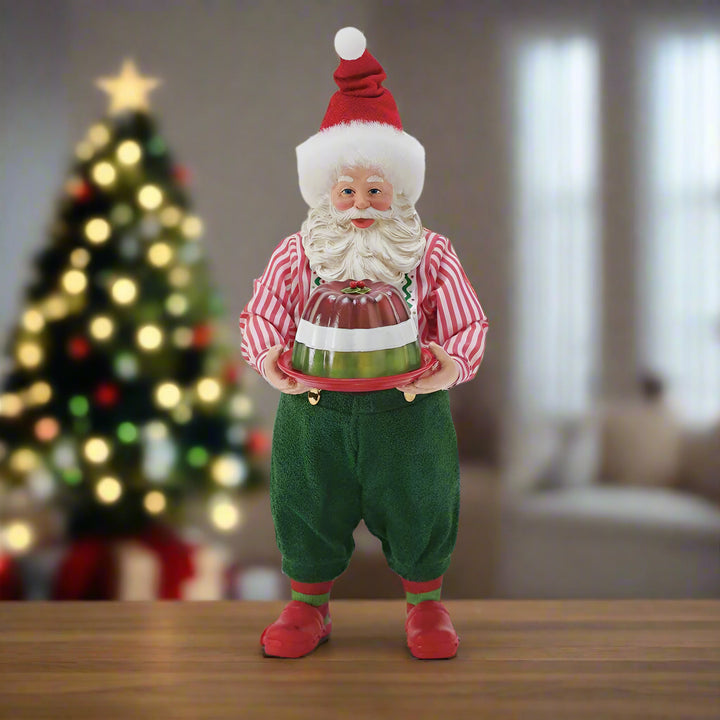 Traditional Santa Claus figure holding a gift on a white background