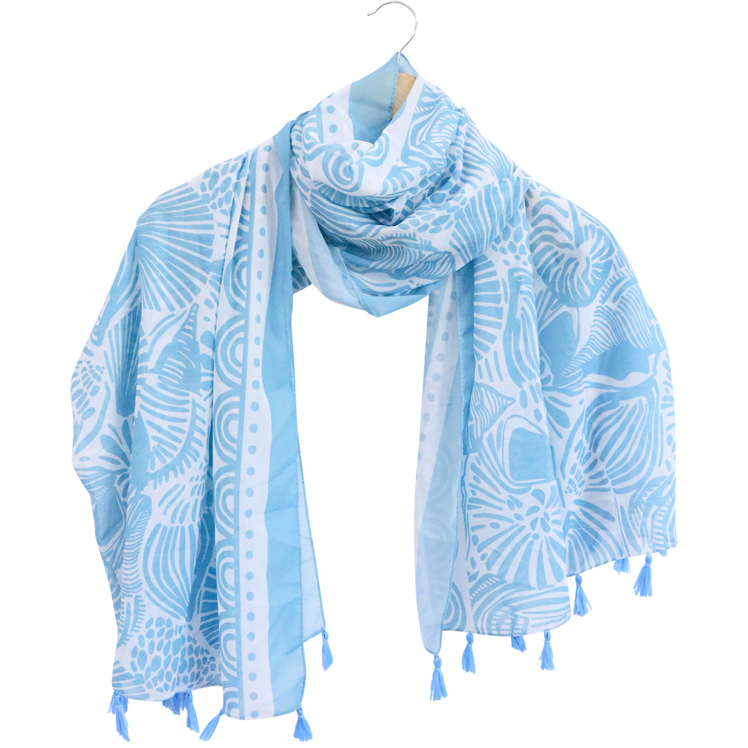 Light blue patterned scarf with tassels on a hanger against a white background