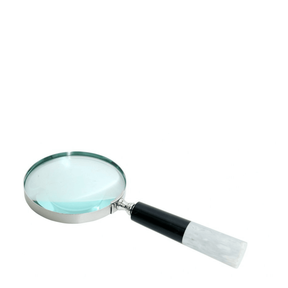Magnifying glass with a black handle on a white background