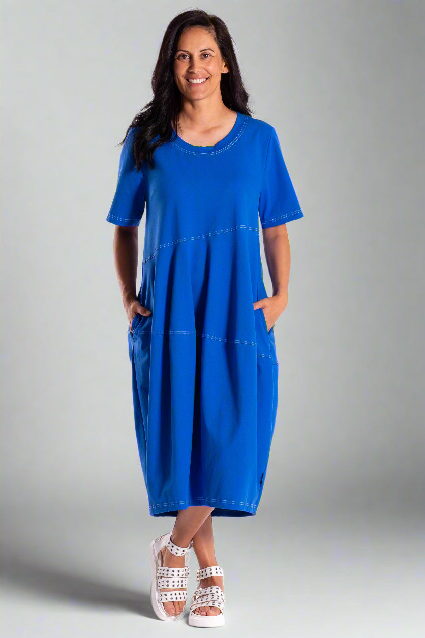 Woman wearing a blue dress on a white background