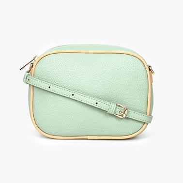 Mint green crossbody bag on a white background