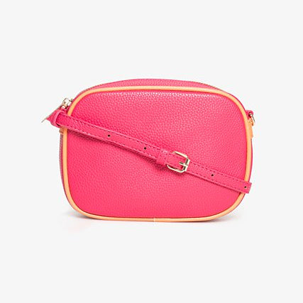 Pink crossbody bag on a light purple background