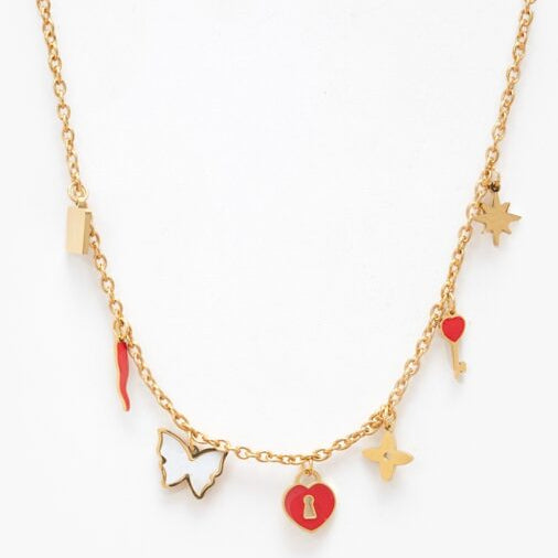 Gold necklace with various charms on a white background