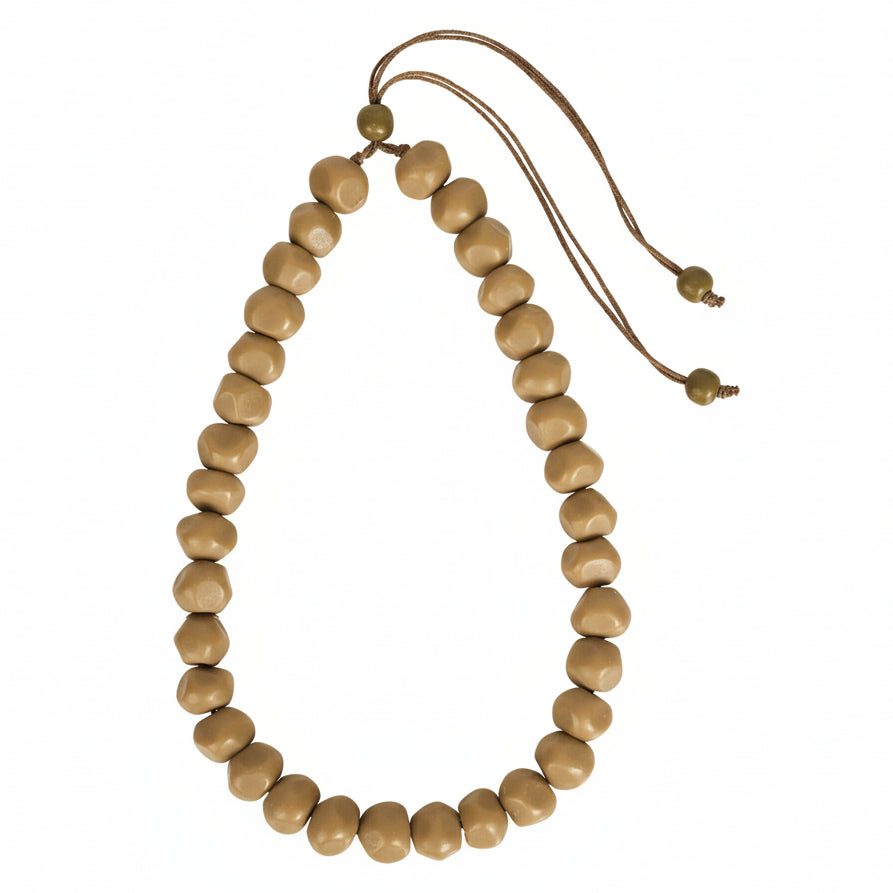 Wooden beaded necklace on a white background