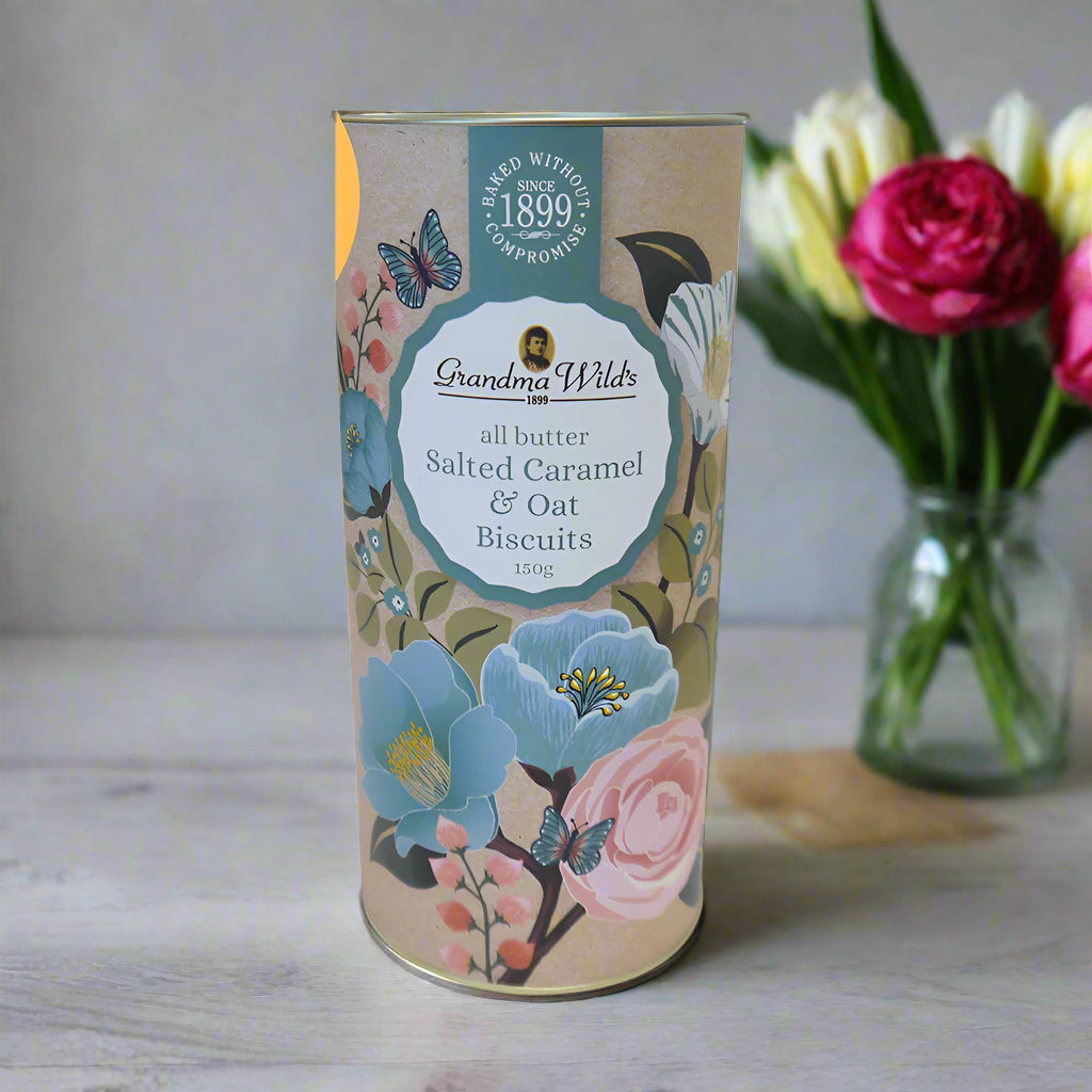 Biscuit tin with floral design and 'Grandma Wild's' branding on a white background