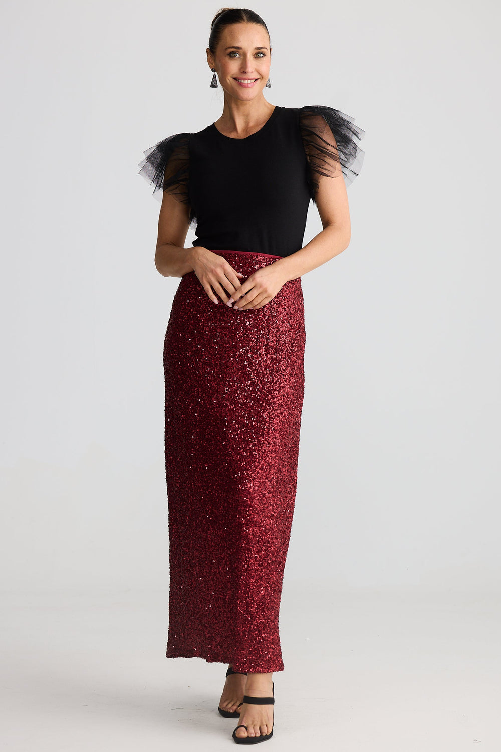 woman wearing the brave & true shari seuion skirt in garnet red with the chance tee in black