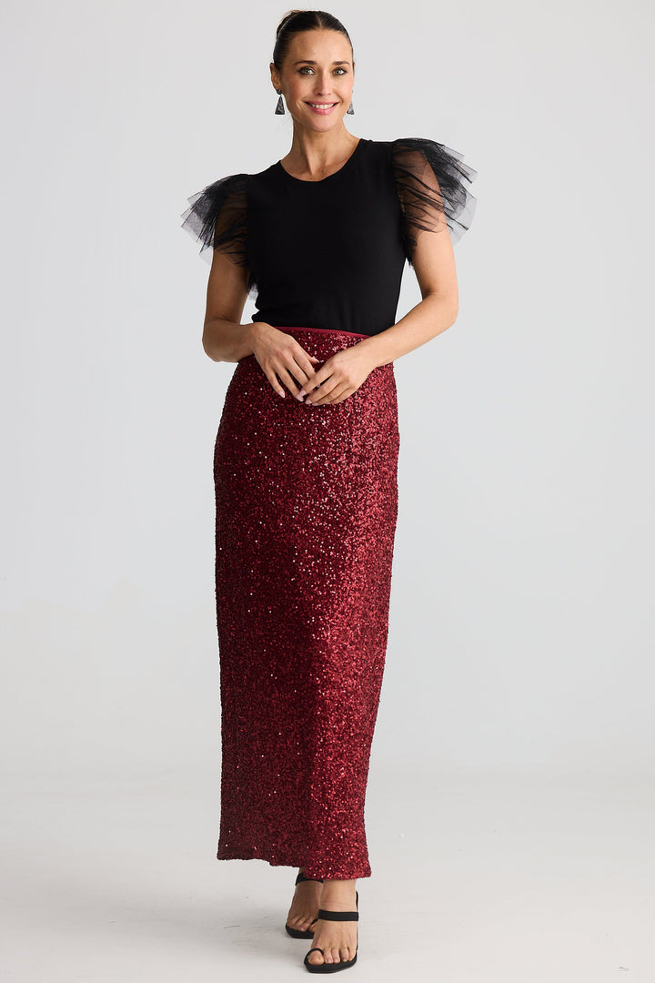 woman wearing the brave & true shari seuion skirt in garnet red with the chance tee in black