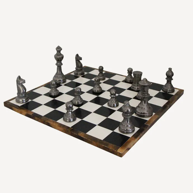 Chessboard with silver chess pieces on a white background