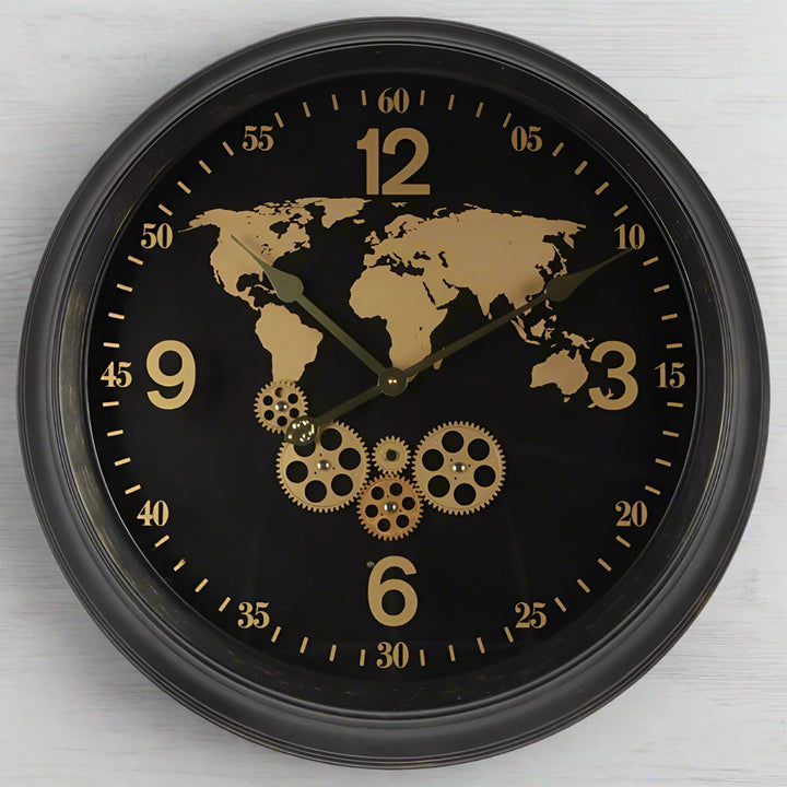 Wall clock with world map and gears design on a black background