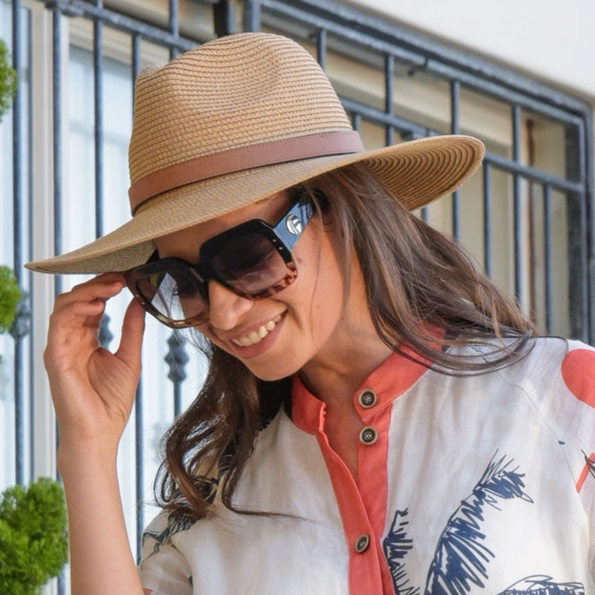 Woman wearing a curate by trelise cooper patterned shirt and hat outdoors