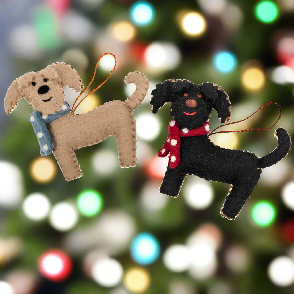 Two dog-shaped ornaments, one brown and one black, on a white background.