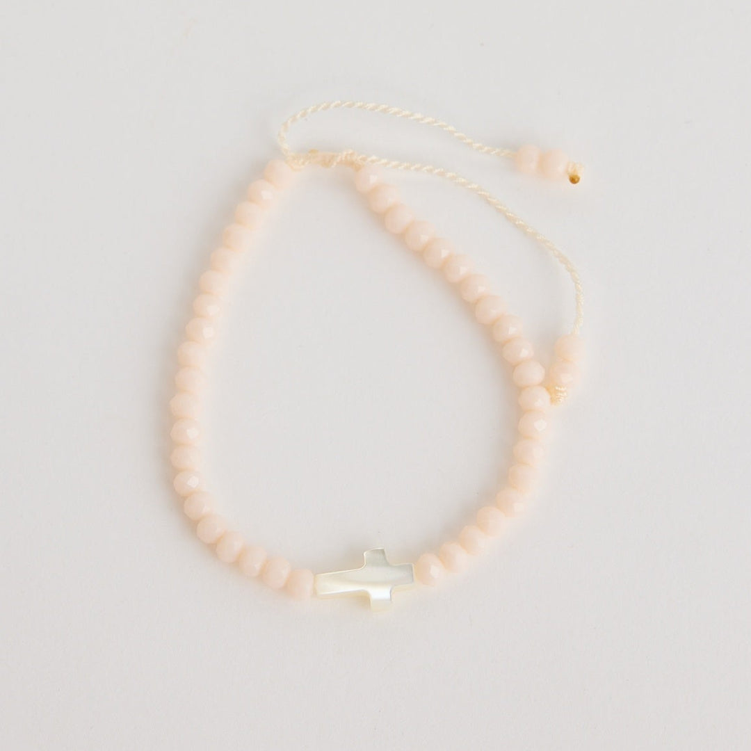 Gold necklace on a light gray background