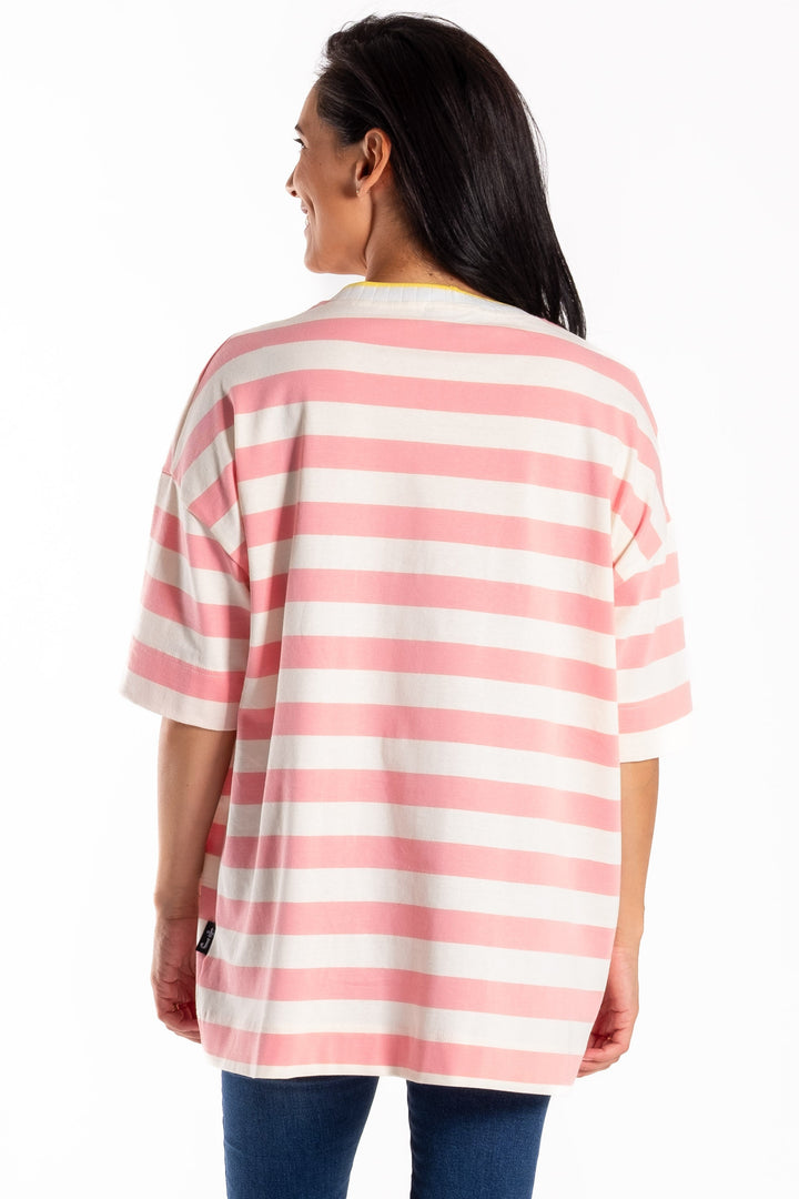 Person wearing a pink and white striped shirt and blue jeans on a white background