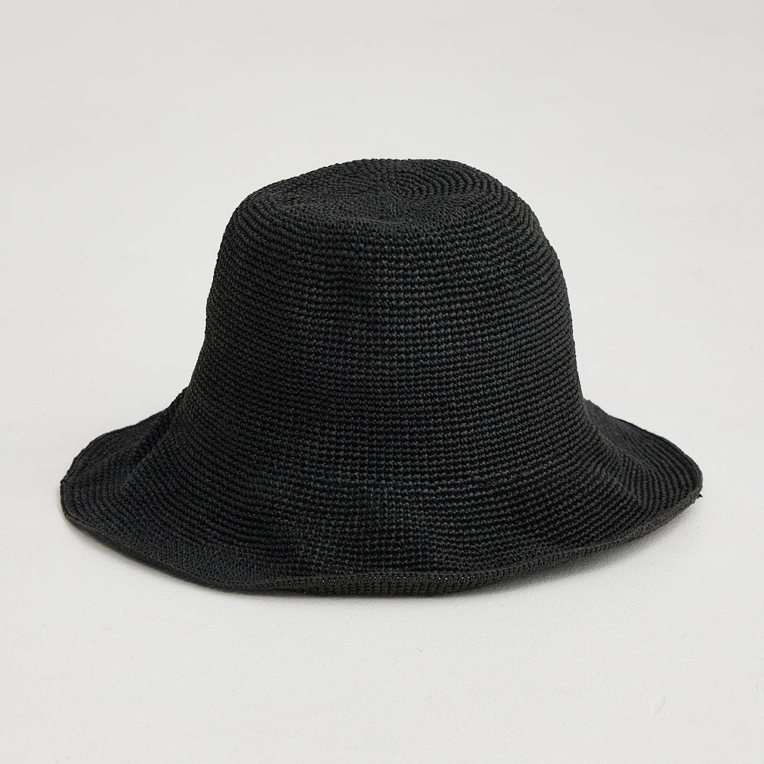 Black bucket hat on a light gray background