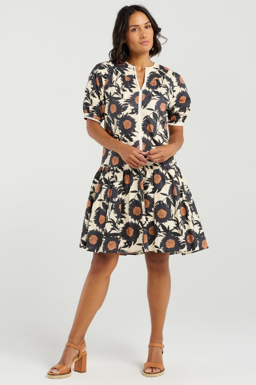 Woman wearing a floral dress on a white background
