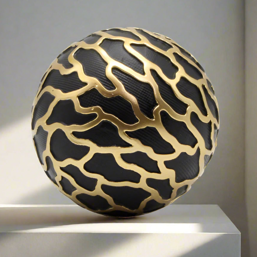 Black and gold decor all with a pattern on a white background