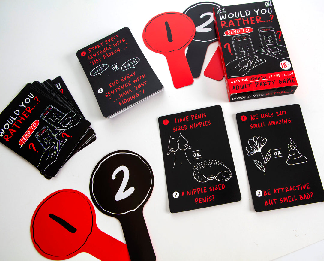 Would You Rather? cards, box and voting paddles laid out - RAPT ONLINE
