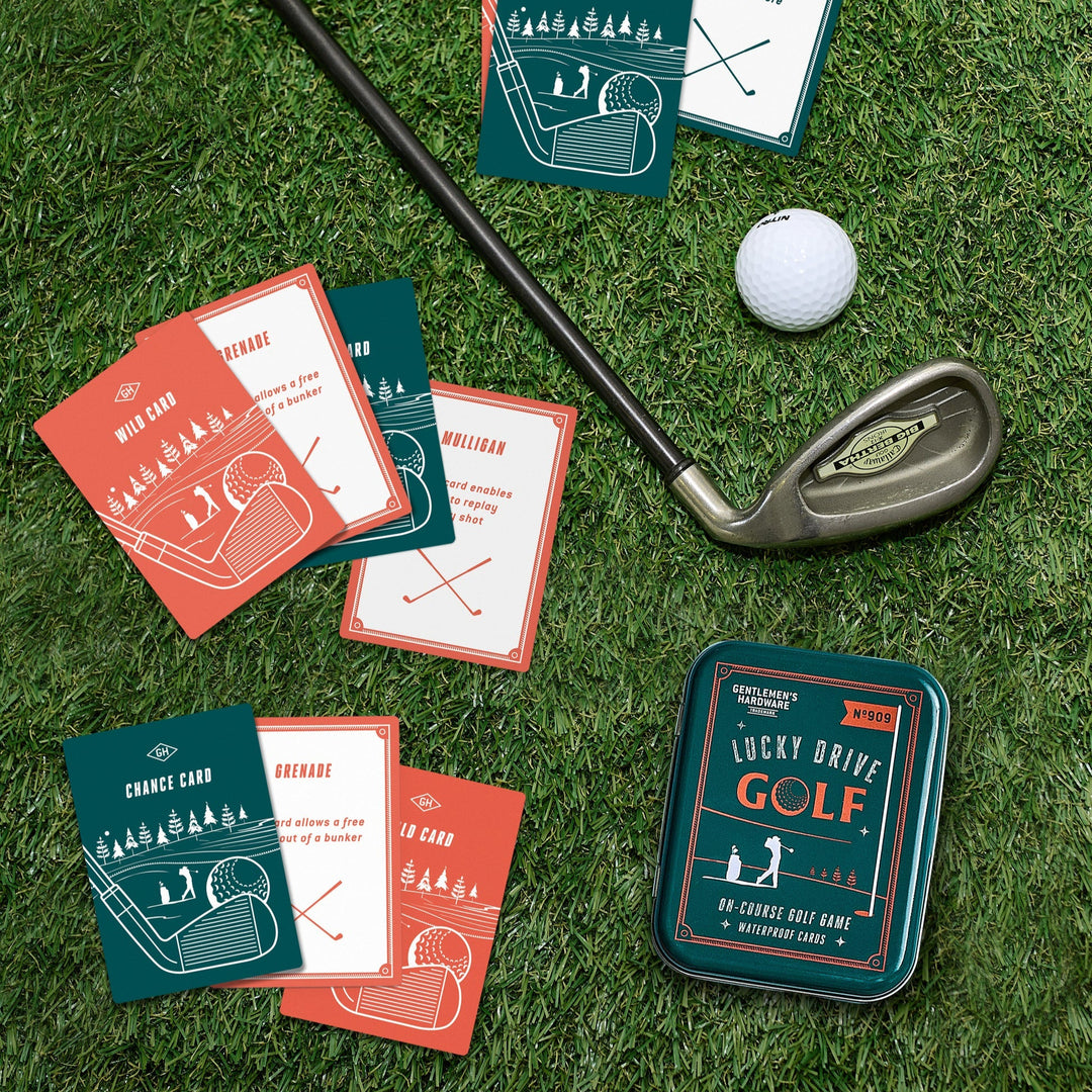 Golf-themed cards and a golf club on grass