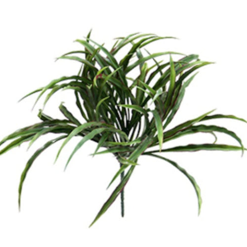 Green artificial plant on a white background