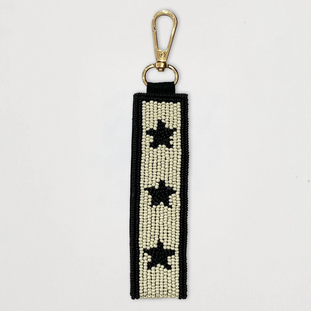 Beaded keychain with star patterns on a white background