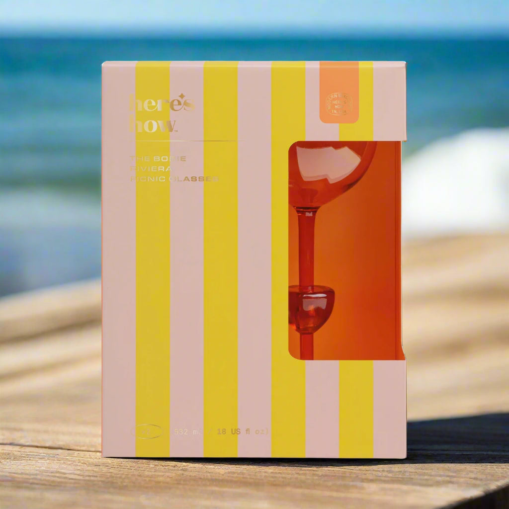 Striped box with a orange picnic glasses inside 