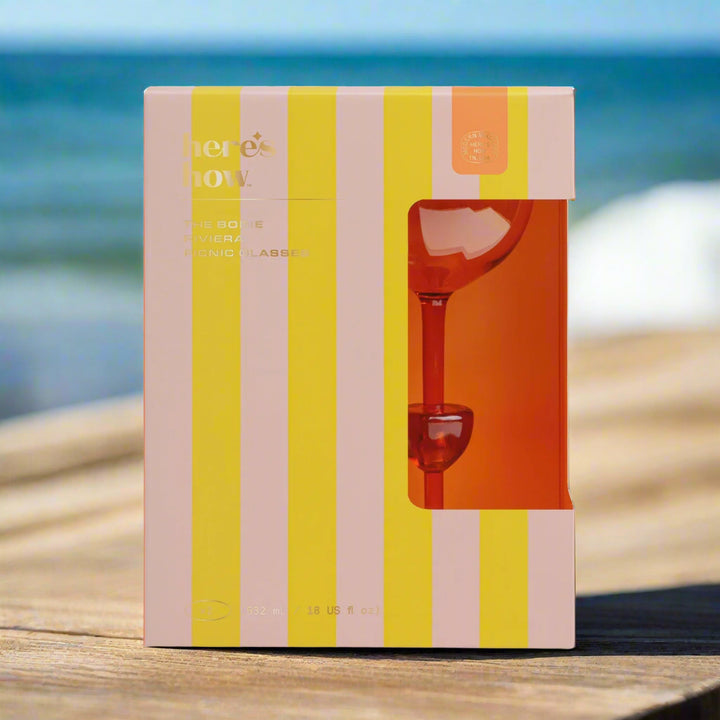 Striped box with a orange picnic glasses inside 