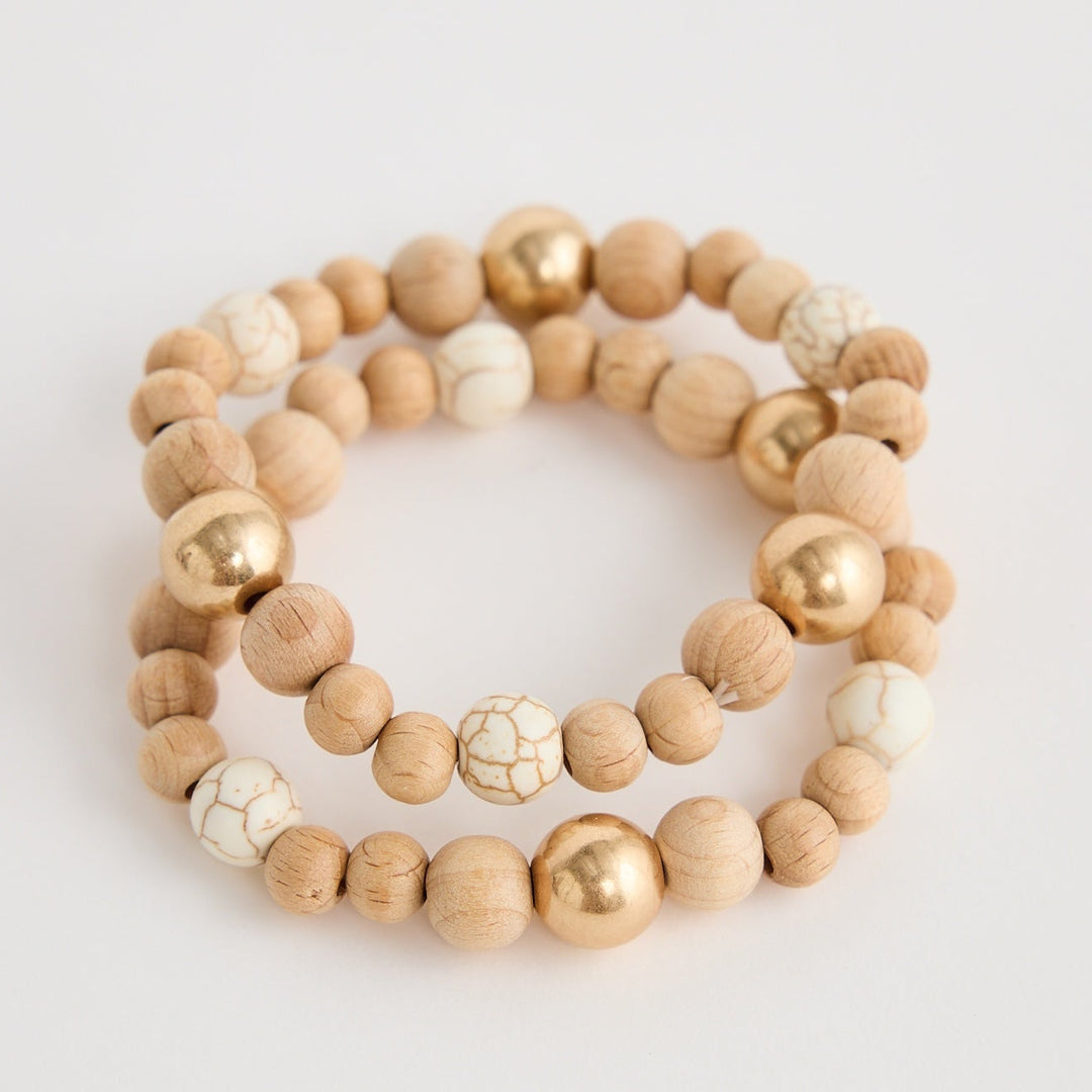 Set of two beaded bracelets on a light gray background