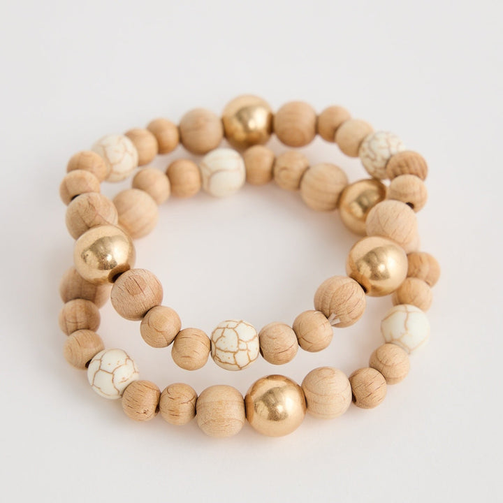 Set of two beaded bracelets on a light gray background