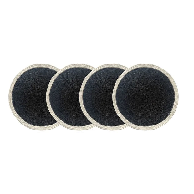 Four black round coasters with white edges on a white background
