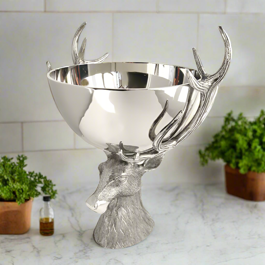 Silver bowl with deer antlers on a white background